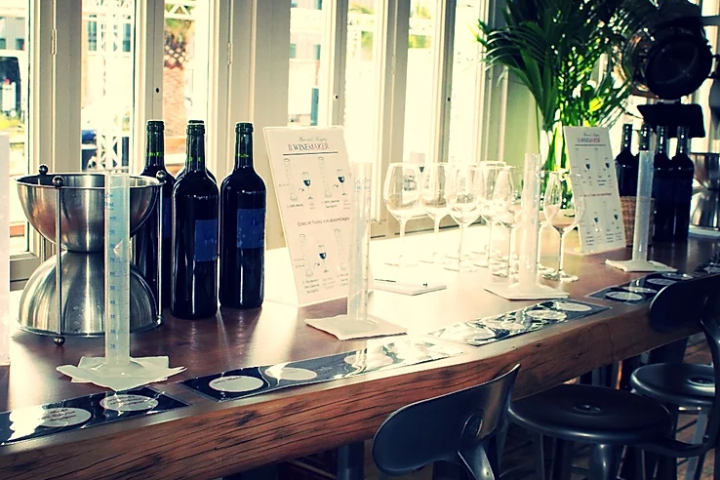 a desk with a laptop computer sitting on top of a table